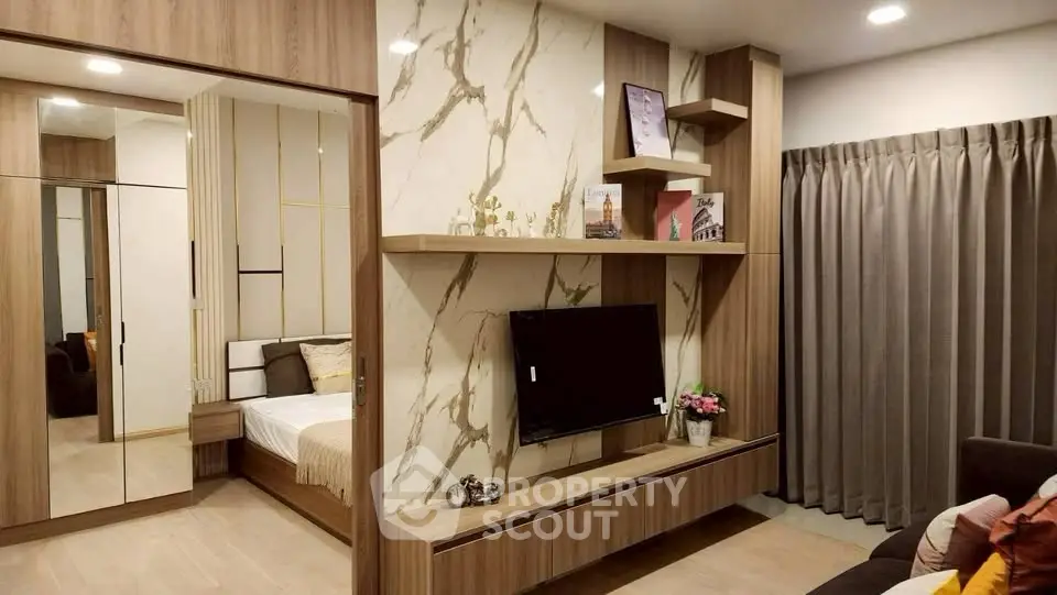 Luxurious modern living room with elegant marble wall and cozy bedroom view.