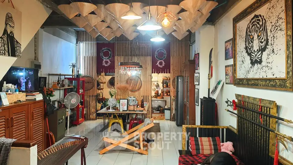 Charming eclectic living room with unique decor and cozy seating area, perfect for relaxation and entertaining.