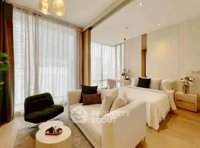 Luxurious modern bedroom with elegant decor and large windows in a high-end apartment.
