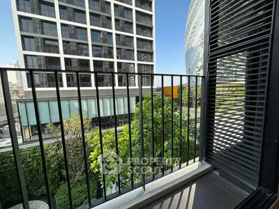 Modern balcony with city view and lush greenery, perfect for urban living.