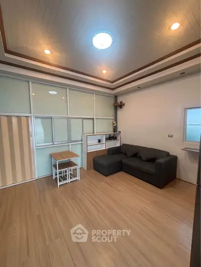 Spacious living room with modern design and cozy seating area