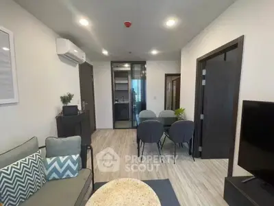 Modern living room with sleek furniture and open layout, perfect for urban living.