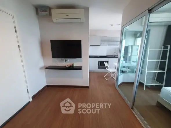 Modern apartment interior with open layout and sleek kitchen design.