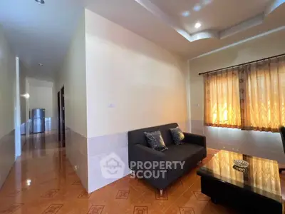 Spacious living room with cozy sofa and natural light