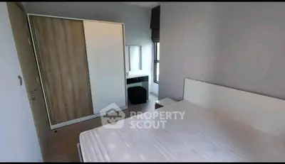 Modern bedroom with minimalist design and large wardrobe