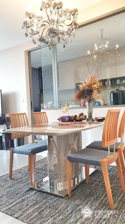 Elegant dining area with modern chandelier and stylish decor