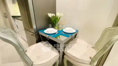 Charming dining nook with elegant chairs and mirrored table in cozy kitchen corner.