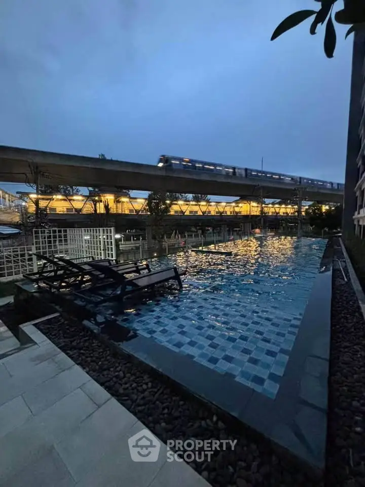 Luxurious rooftop pool with stunning city view and modern design, perfect for relaxation and leisure.