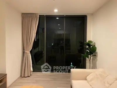 Modern living room with large window and cozy sofa in stylish apartment