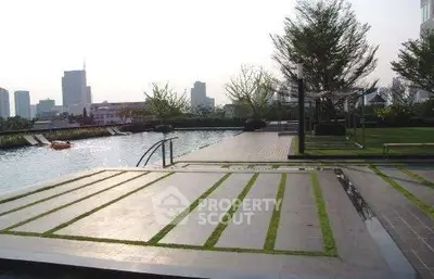 Luxurious rooftop pool with stunning city views and lush greenery