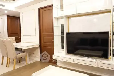 Modern living room with elegant furniture and built-in TV unit