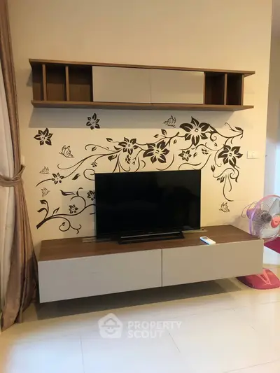 Stylish living room with modern TV stand and floral wall decor