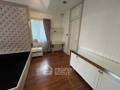 Elegant bedroom with hardwood floors and stylish furniture