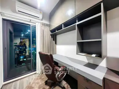 Modern study room with city view, sleek desk, and comfortable chair in a high-rise apartment.