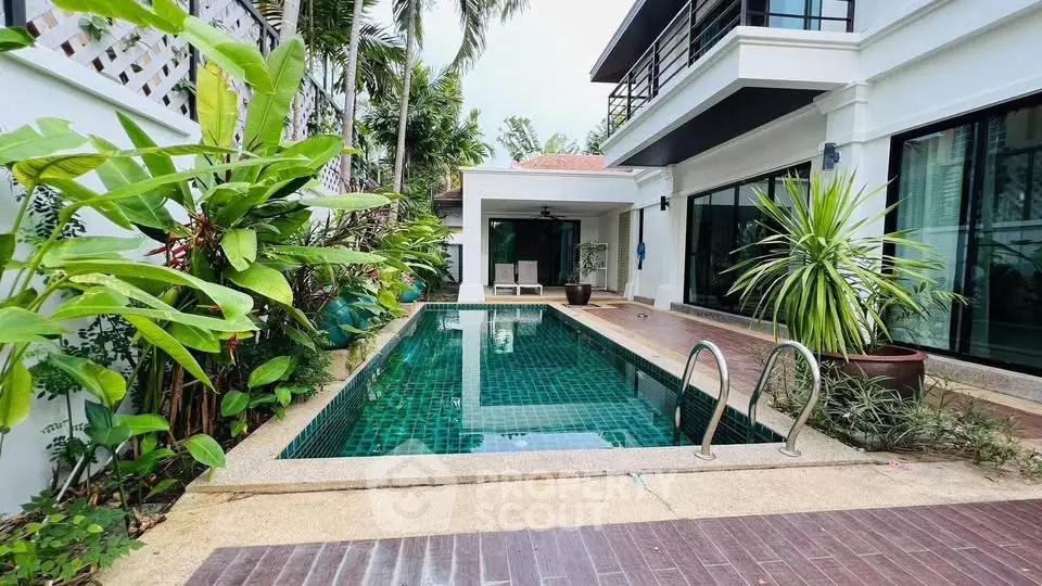 Luxurious villa with private pool and lush garden, perfect for tropical living.