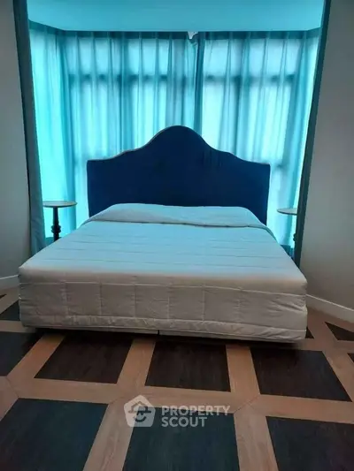 Modern bedroom with stylish flooring and elegant headboard design
