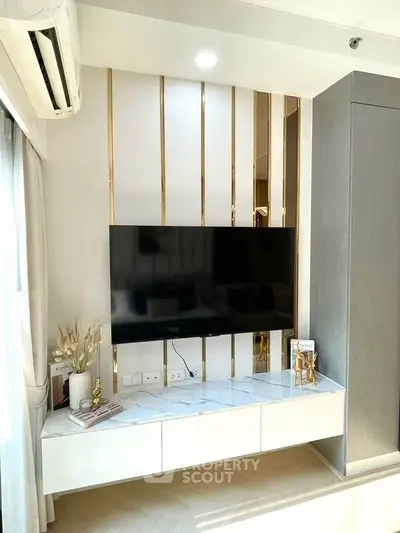 Modern living room with wall-mounted TV and stylish decor