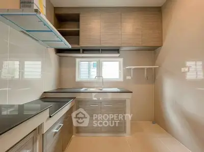 Modern kitchen with sleek cabinetry and ample storage space