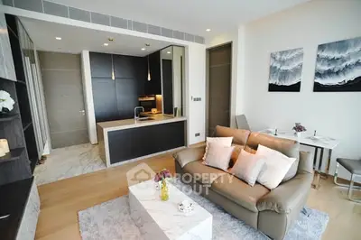 Modern open-layout living room with sleek kitchen and stylish decor