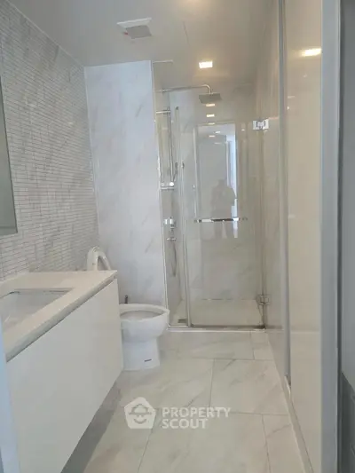 Modern bathroom with sleek design and glass shower enclosure