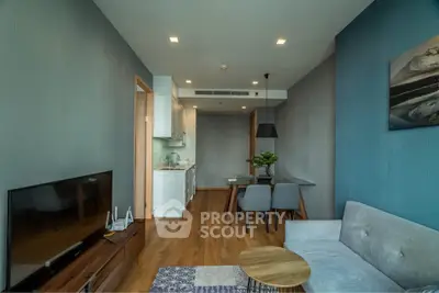 Modern living room with open kitchen and stylish decor