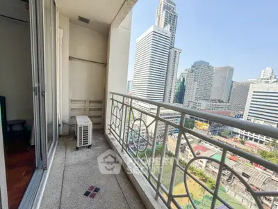 Spacious balcony with stunning city view in modern high-rise building