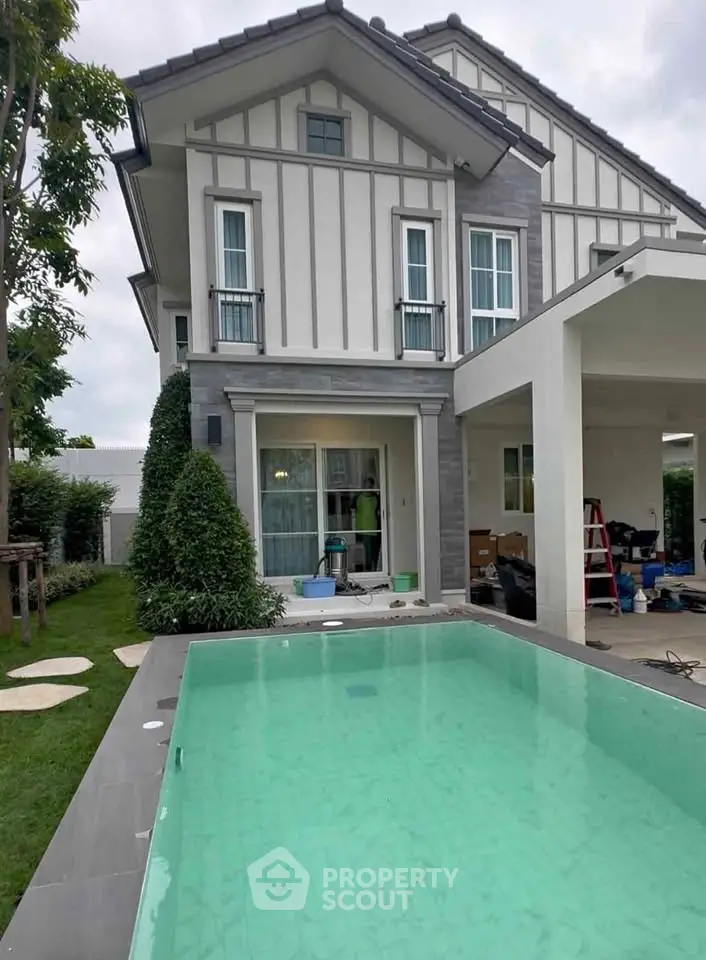 Stunning modern home with private pool and lush garden, perfect for luxurious living.