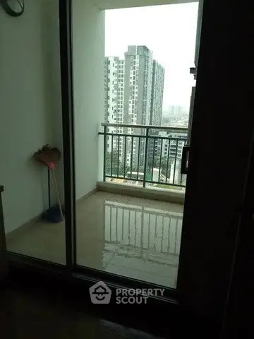 Modern high-rise apartment balcony with city view
