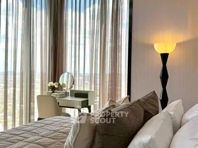 Luxurious bedroom with floor-to-ceiling windows and elegant decor