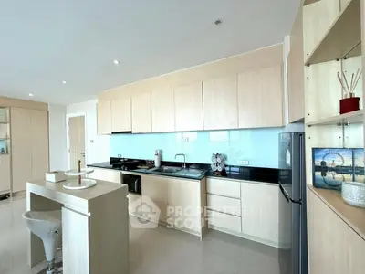 Modern kitchen with sleek cabinetry and open layout in a bright apartment