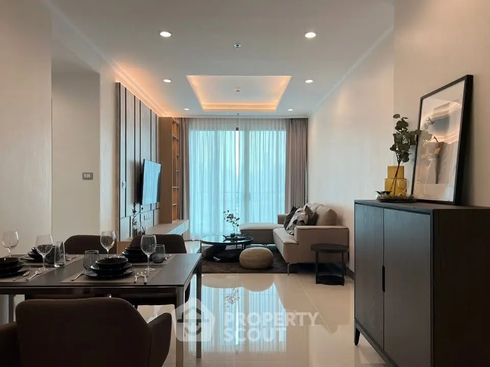 Elegant modern living room with dining area, featuring stylish furniture and ambient lighting.