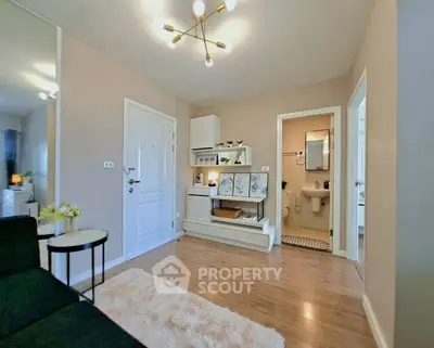 Modern living room with stylish decor and wooden flooring in a cozy apartment.