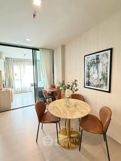 Modern dining area with marble table and leather chairs in stylish apartment