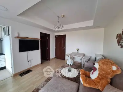 Cozy living room with plush teddy bear and modern decor