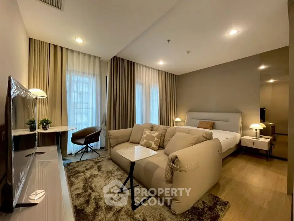Luxurious modern living room with plush sofa and elegant decor in a stylish apartment.