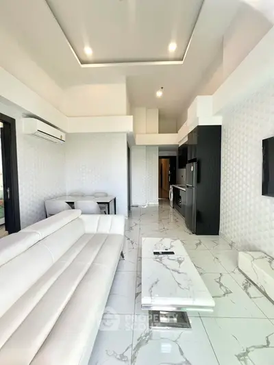 Luxurious modern living room with sleek white furniture and marble flooring
