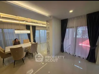 Modern living room with sleek design and ample natural light