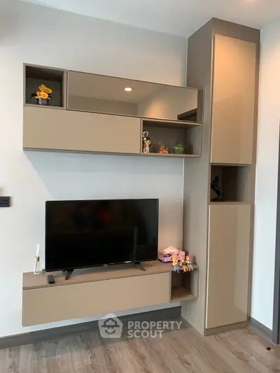 Modern living room with sleek TV unit and stylish shelving