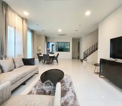 Spacious modern living room with elegant decor and dining area