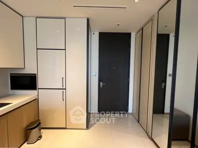 Modern kitchen with sleek cabinetry and built-in appliances