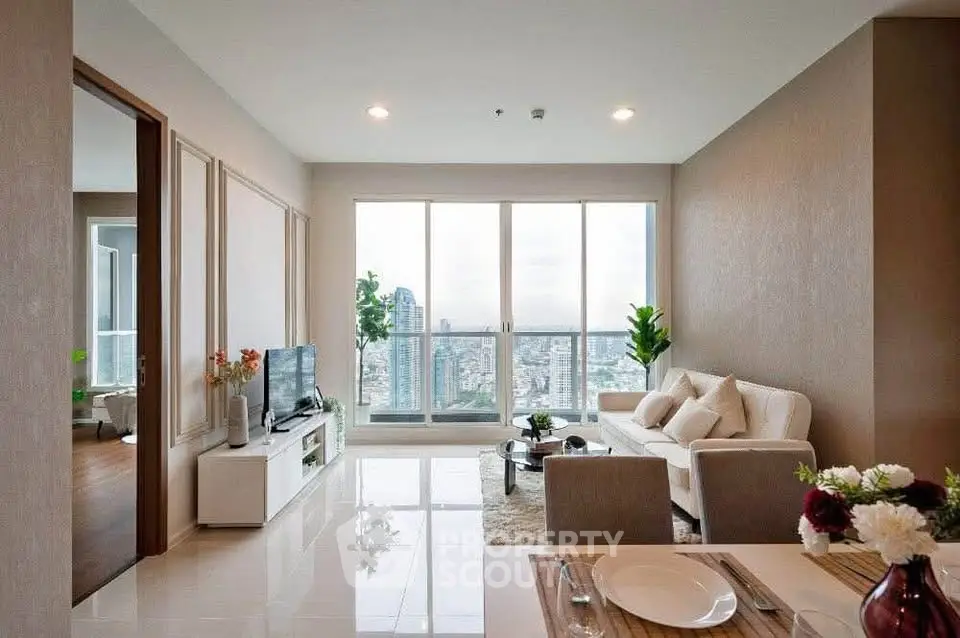 Spacious modern living room with city view, elegant decor, and natural light.