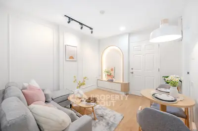 Bright and cozy living room with modern decor and dining area