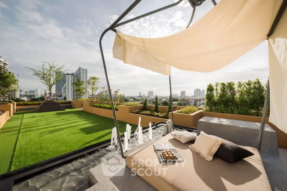 Luxurious rooftop terrace with stunning city views and modern lounge area.