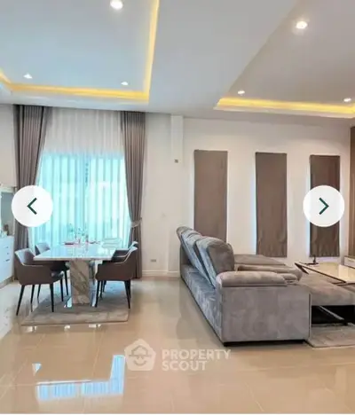 Spacious modern living room with elegant dining area and stylish decor