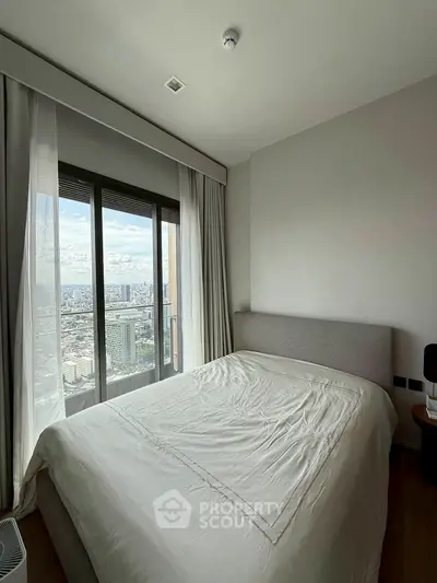 Modern bedroom with city view and large window, featuring a cozy bed and minimalist decor.