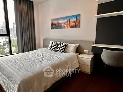 Modern bedroom with city view, stylish decor, and cozy ambiance in urban apartment.