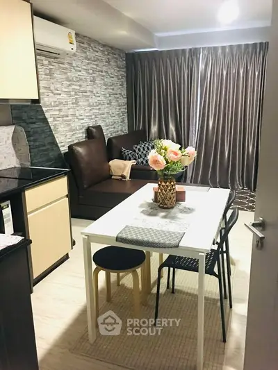 Chic modern living room with stylish dining area and cozy seating, perfect for urban living.