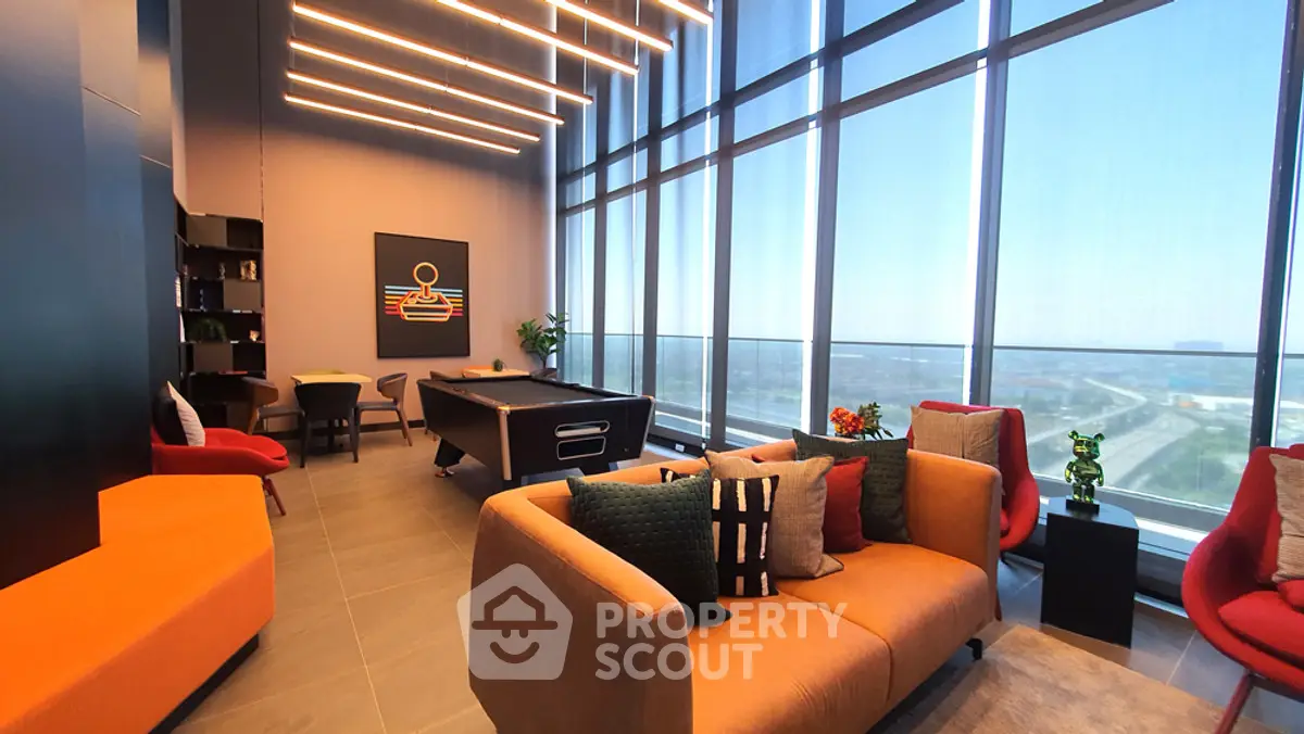 Luxurious modern living room with floor-to-ceiling windows and stylish decor.