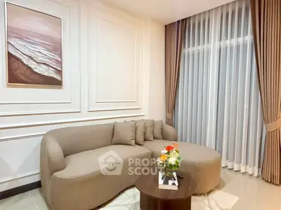 Elegant living room with modern beige sofa and stylish decor