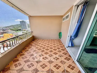 Spacious balcony with city view, perfect for relaxation and enjoying the outdoors.